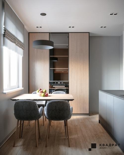 Кухня выполнена в минималистичном стиле за счет использования встроенных решений и минимума предметов декора. 01