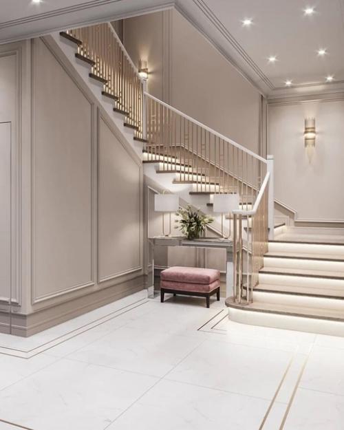 Очень стильная прихожая, тут все очень продумано: лестница с подсветкой, матовые стены с молдингами, двери скрытого монтажа. 01