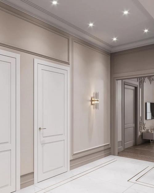 Очень стильная прихожая, тут все очень продумано: лестница с подсветкой, матовые стены с молдингами, двери скрытого монтажа. 04