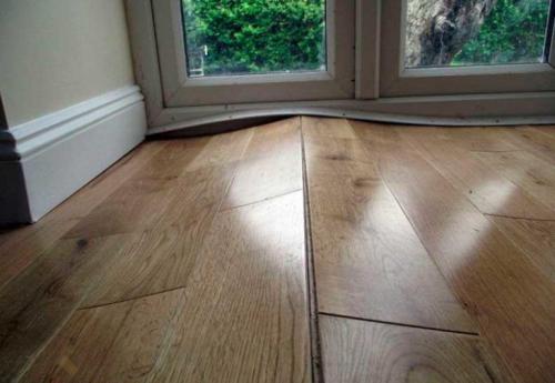 Как убрать вздутие ламината после намокания. Почему вздувается ламинат: причины и последствия 03