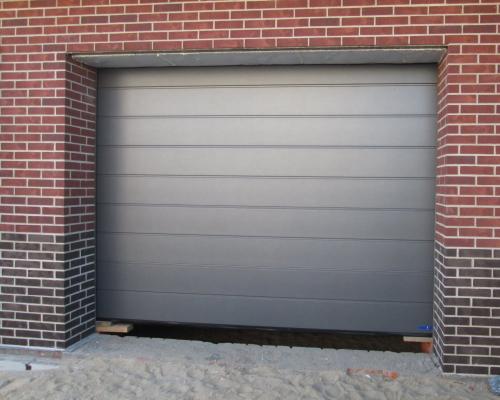 Каковы особенности конструкции секционных ворот. Как устроены секционные ворота?